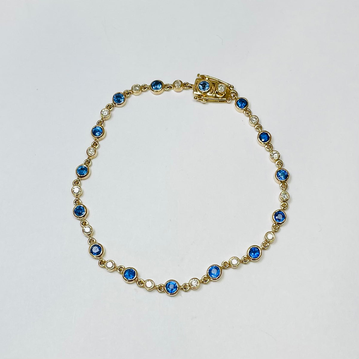 blue sapphire diamond bezel bracelet Theodosia Jewelry