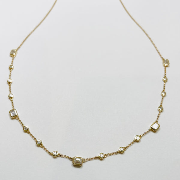 Emerald and brilliant cut diamond bezel set fringe necklace