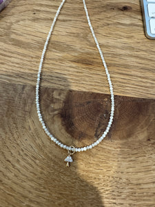 delicate mother of pearl necklace with mushroom charm