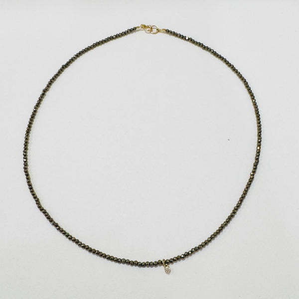 delicate necklace with prong set diamond