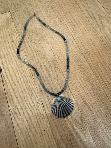 shaded blue sapphire necklace with shell pendant