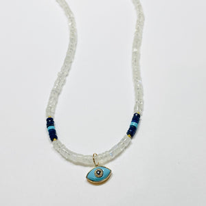 turquoise evil eye necklace on moonstone