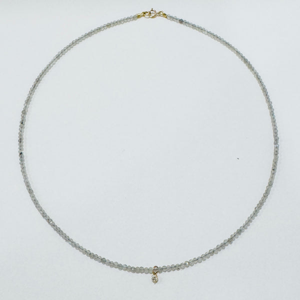 delicate necklace with prong set diamond