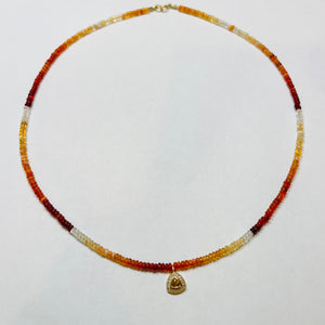delicate fire opal necklace with saphire charm