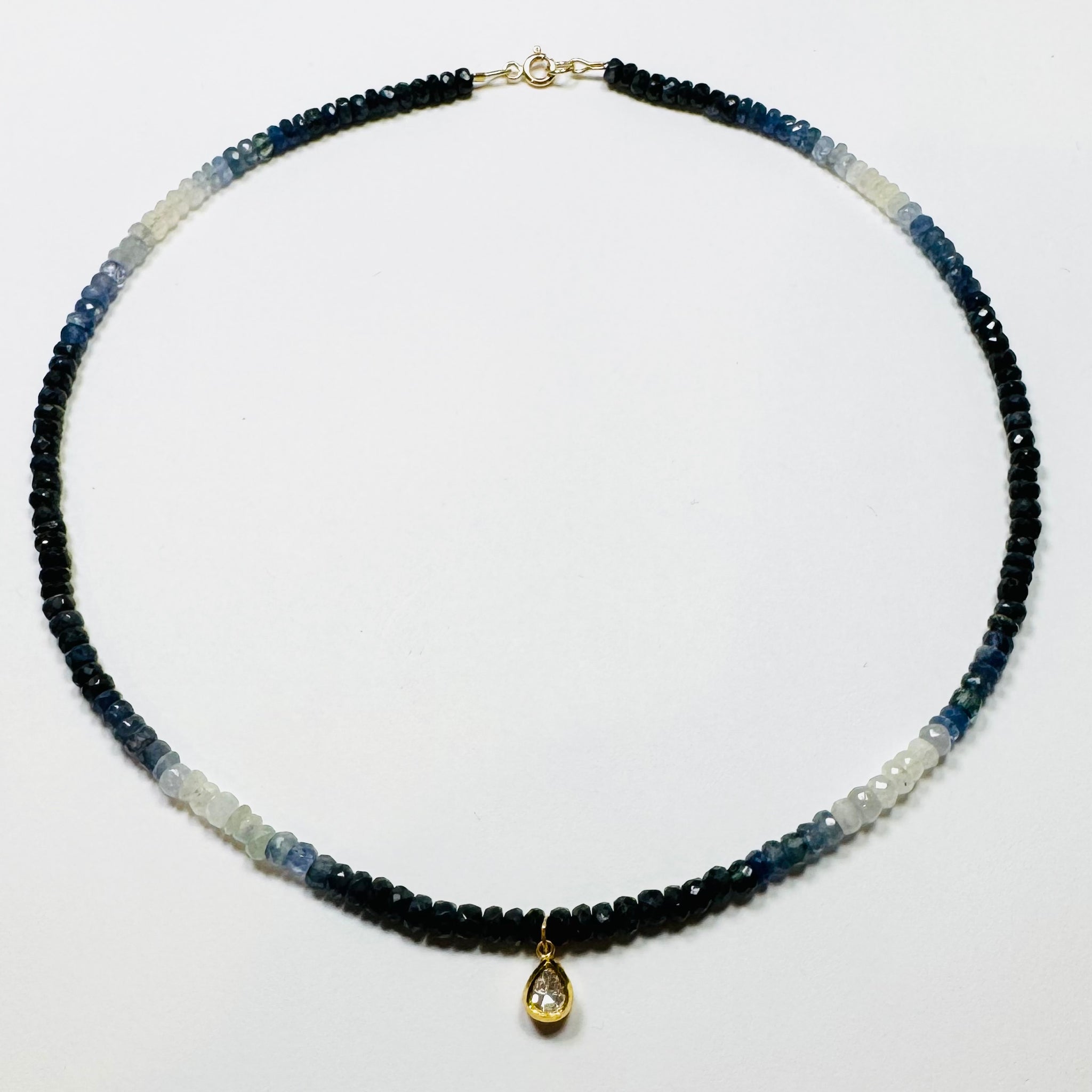 shaded blue sapphire necklace with rough cut diamond teardrop charm