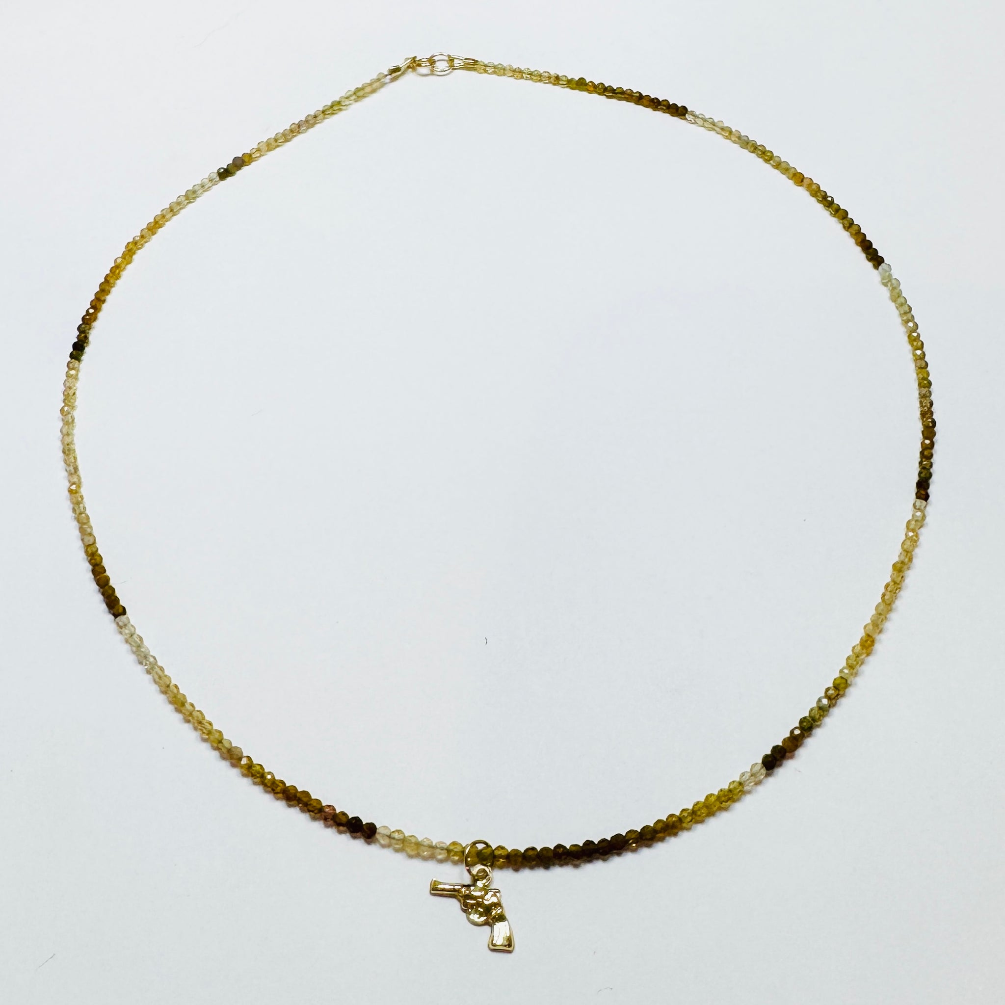 delicate with pistol charm