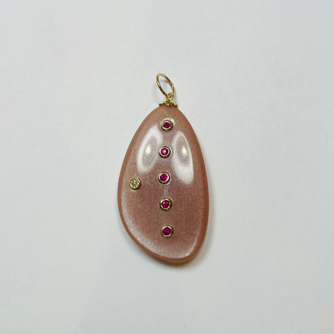 freeform peach moonstone with rubies and diamond