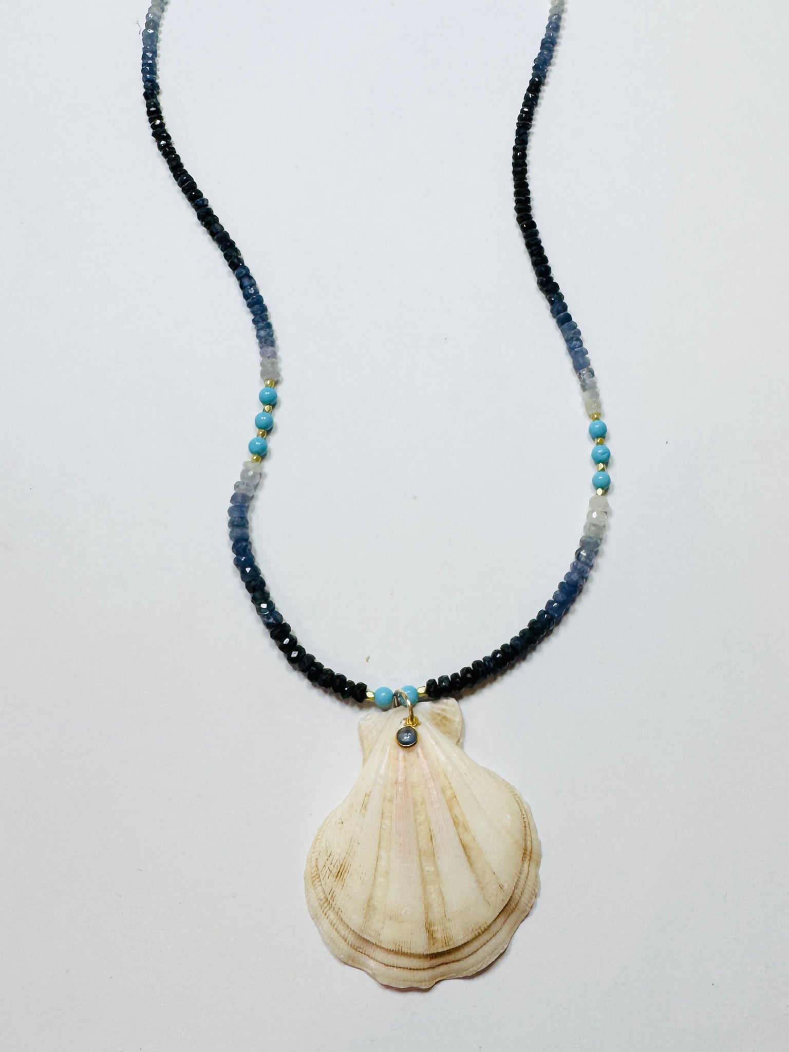 shaded blue sapphire and turquoise necklace with strawberry shell pendant