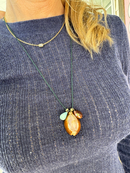 Kumihimo silk cord charm necklace, teal with blue opal, pearl, and purple cowrie shell