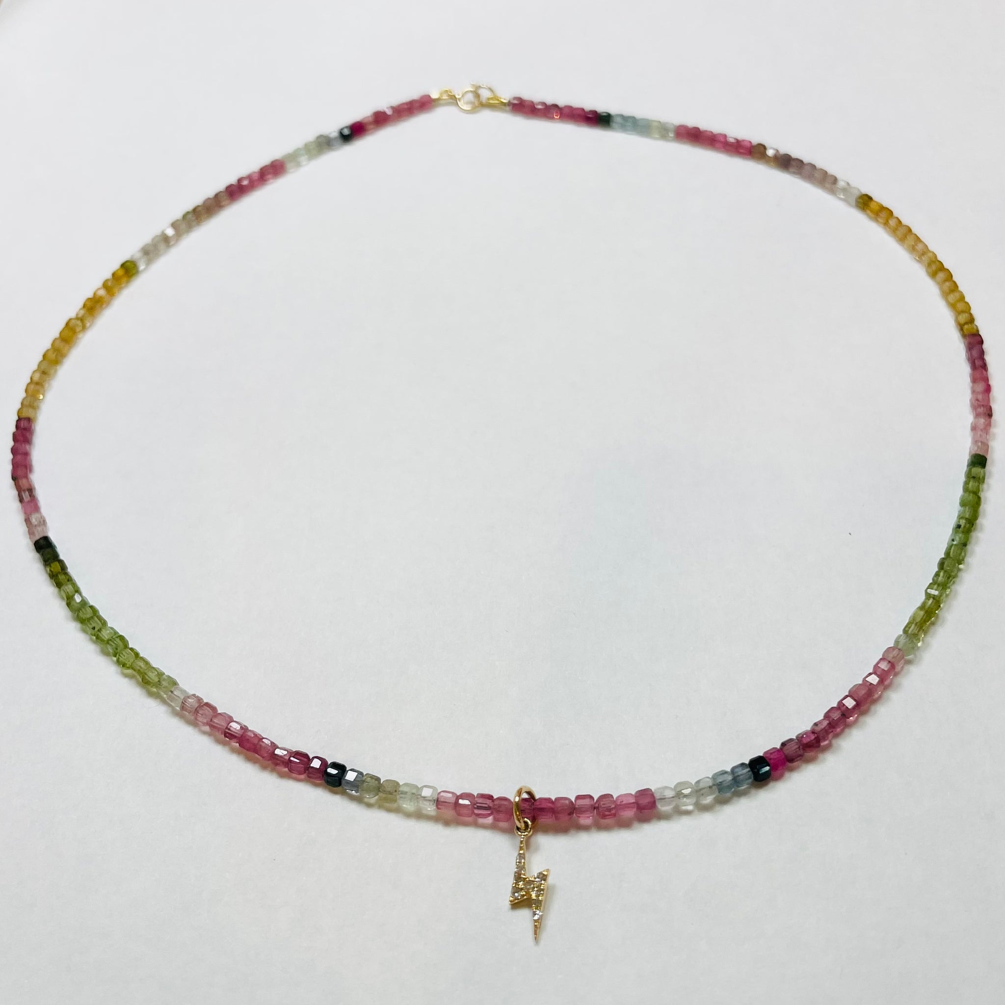 delicate shaded tourmaline necklace with lightning bolt charm