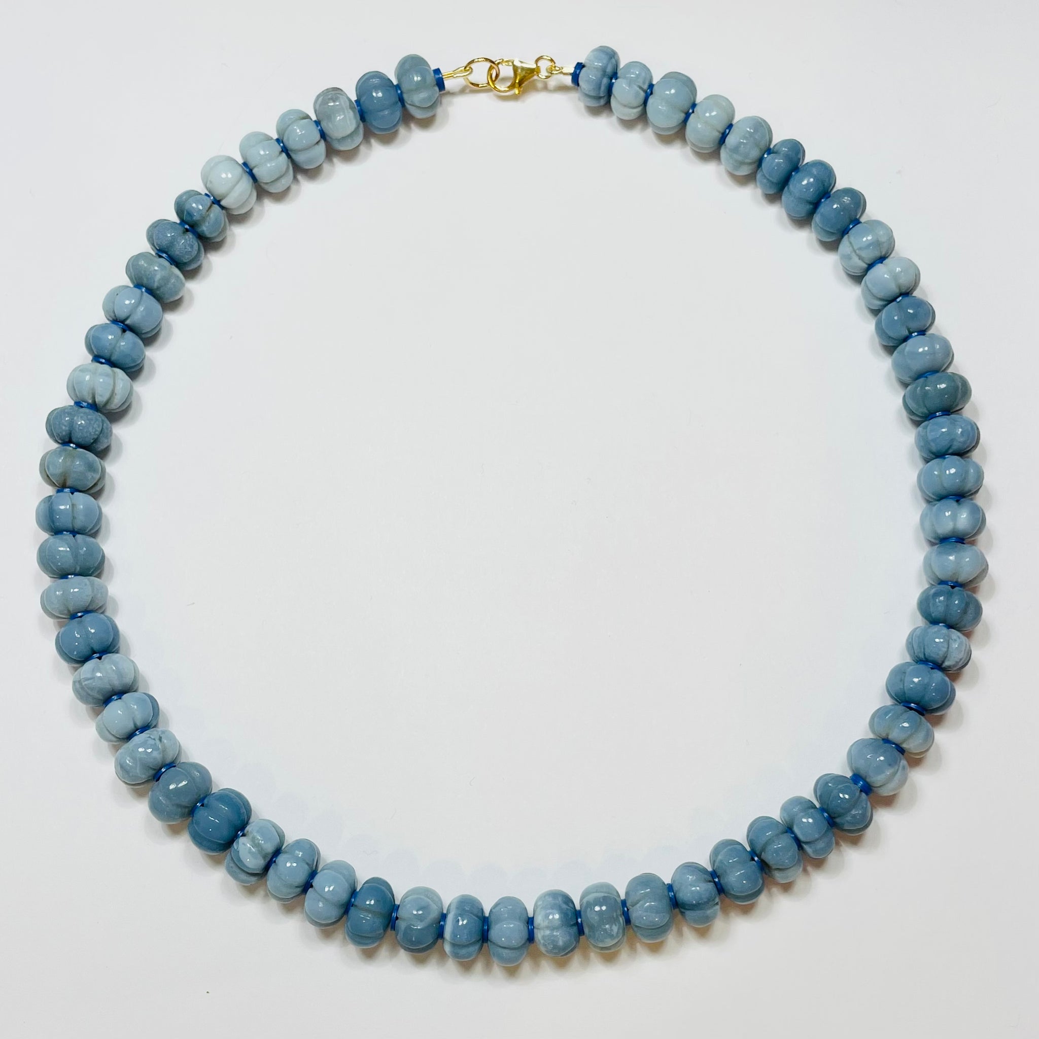 carved peruvian dark blue opal candy necklace