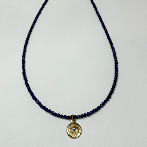 delicate lapis necklace with evil eye medallion charm