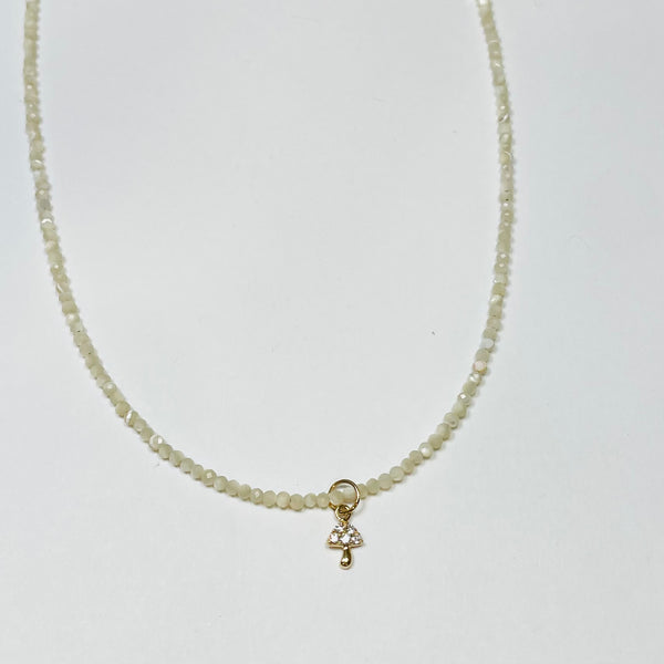 delicate mother of pearl necklace with mushroom charm