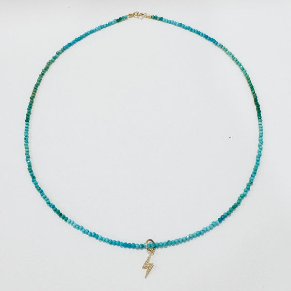delicate gemstone necklace with lightning bolt charm