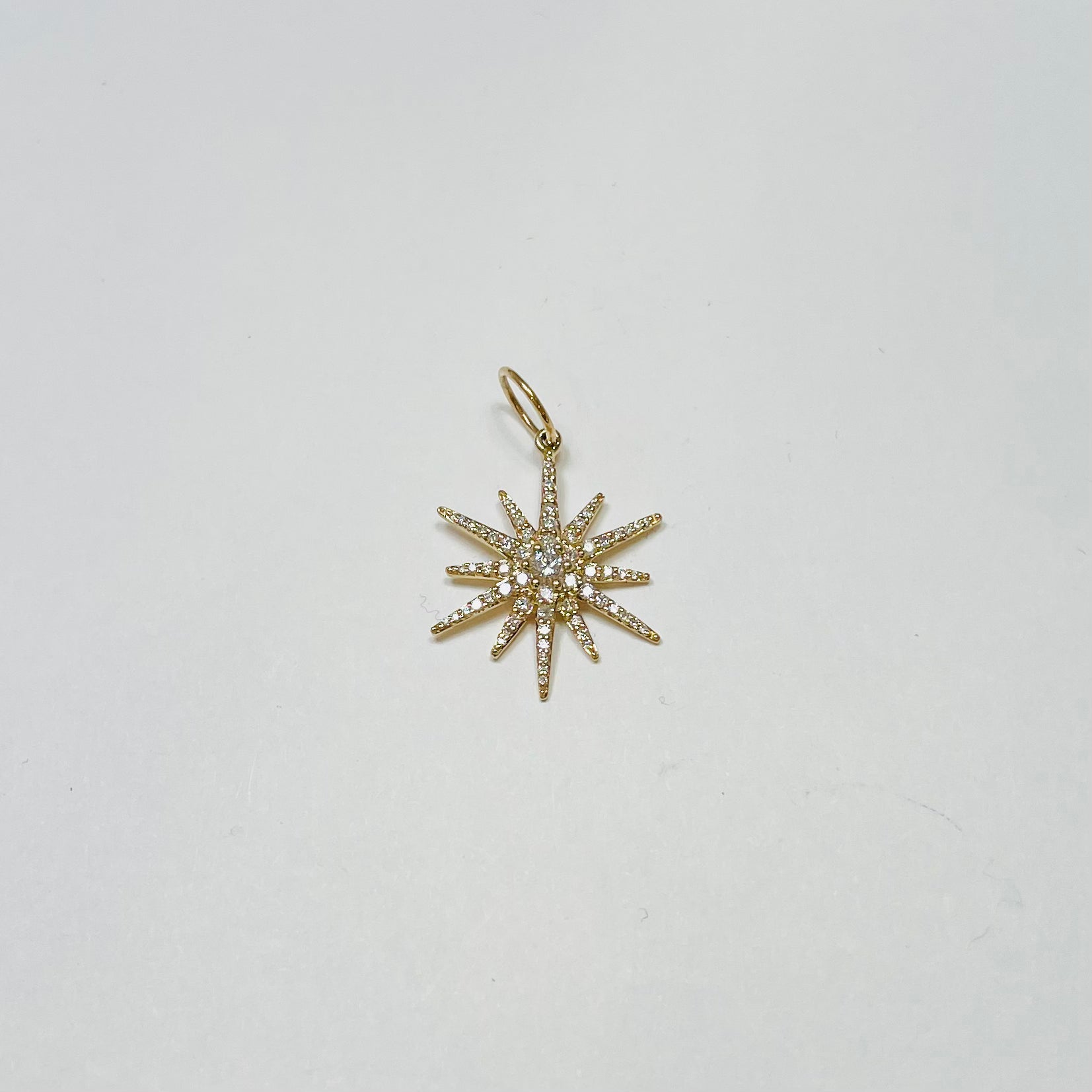 pave diamond starburst pendant