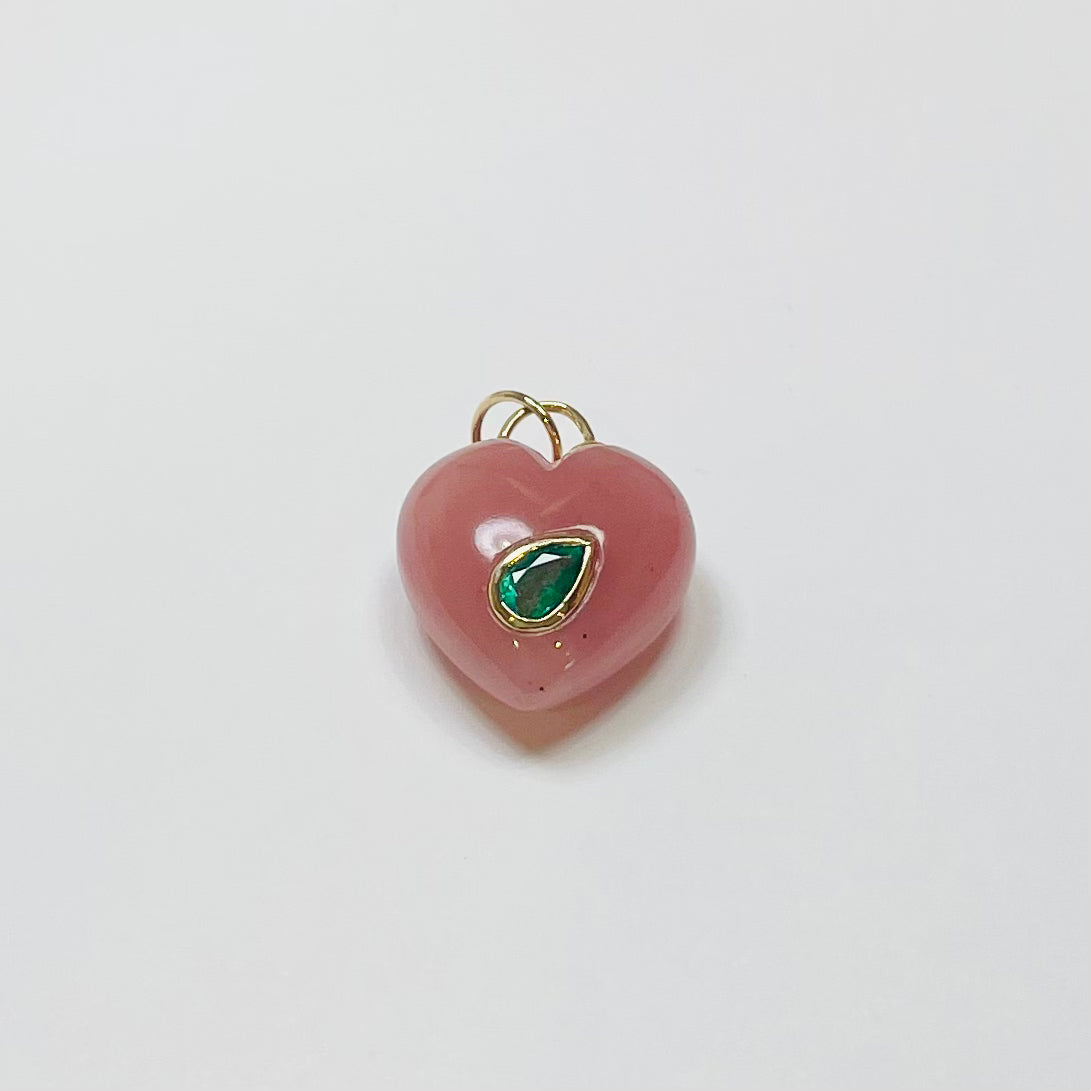puffy rhodochrosite heart pendant with 14 kt gold bezel emerald