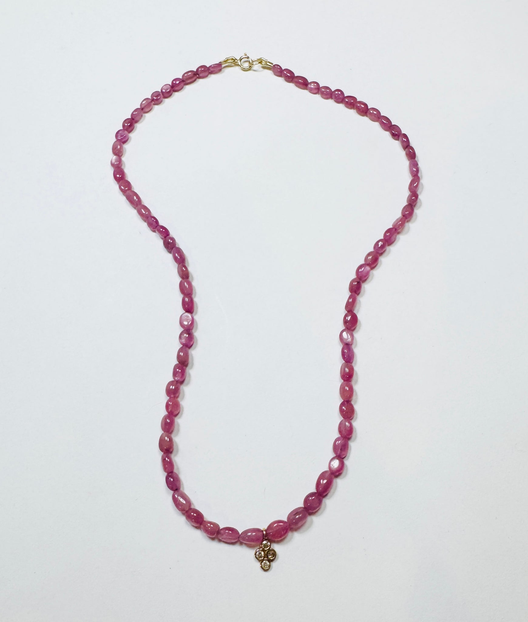 delicate pink sapphire seed bead necklace with bezel diamond charm