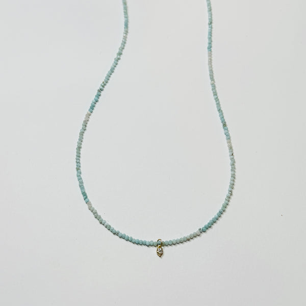 delicate necklace with prong set diamond