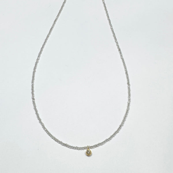 delicate necklace with bezel set diamond