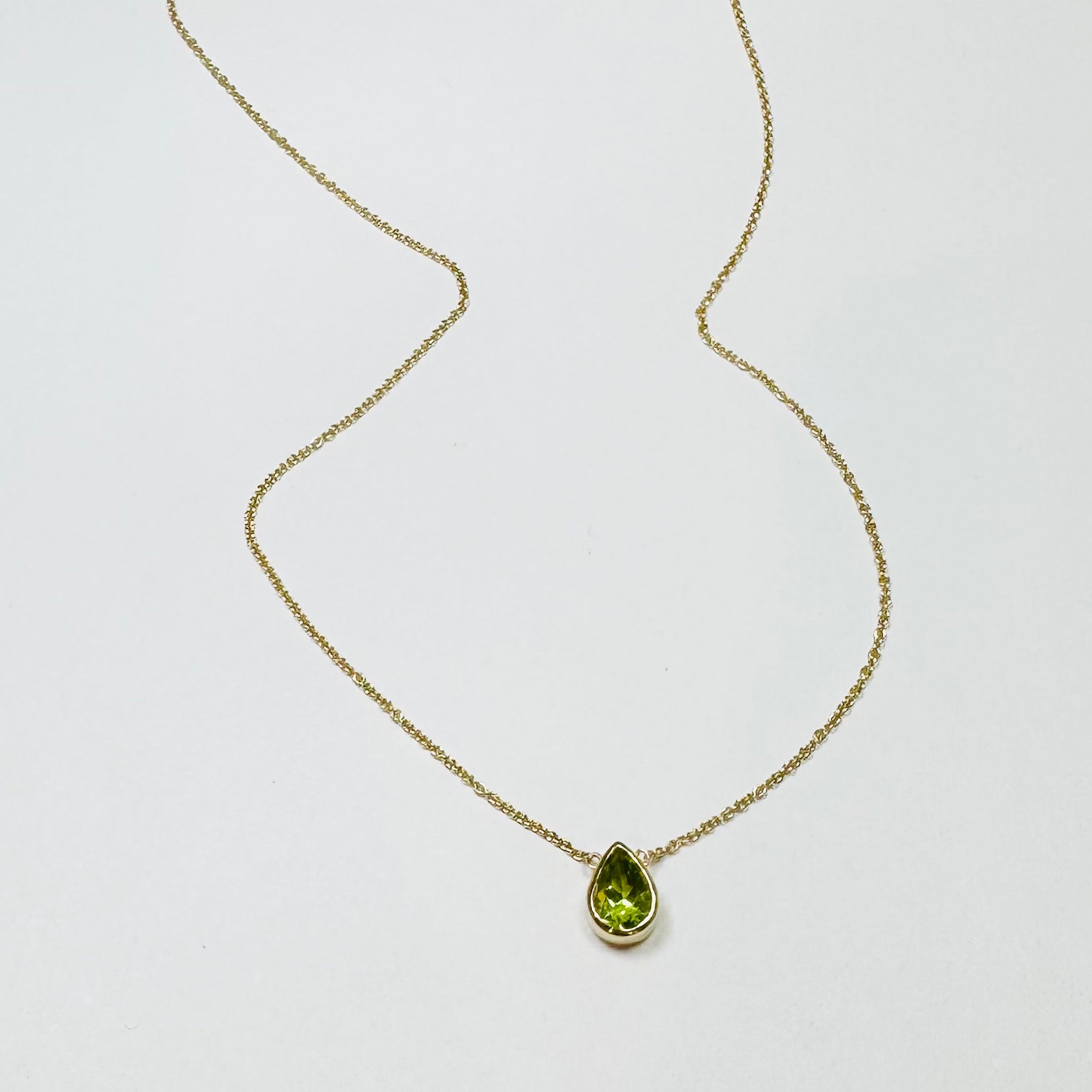 bezel set pear peridot necklace