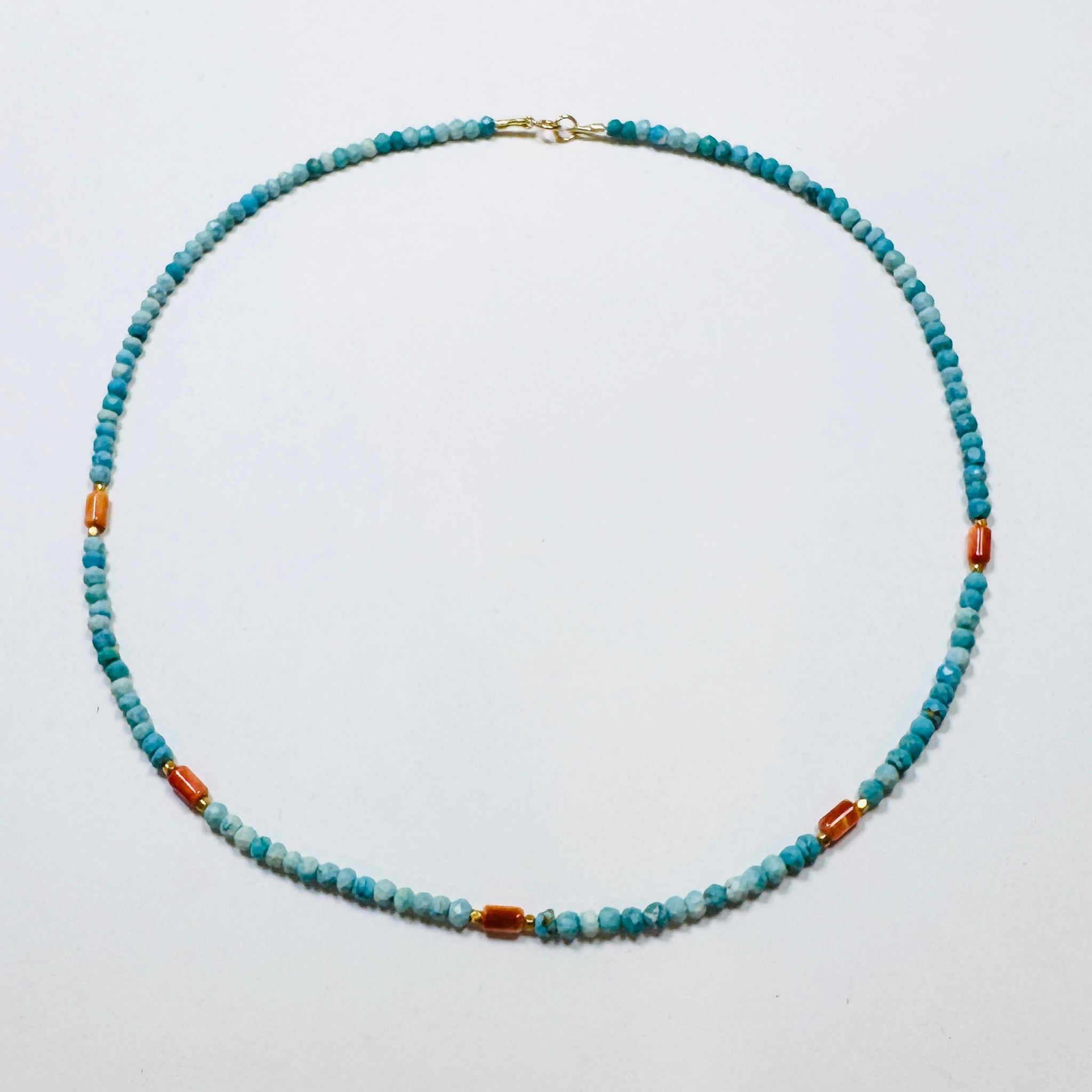 turquoise, coral, and gold beads