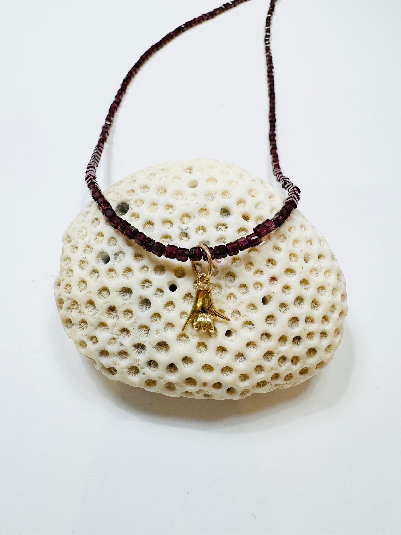 delicate garnet block necklace with spurs up charm