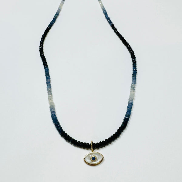 shaded blue sapphire necklace with evil eye charm