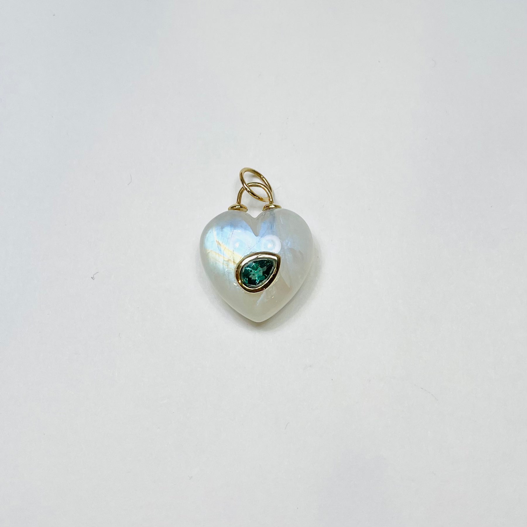puffy moonstone heart pendant with emerald