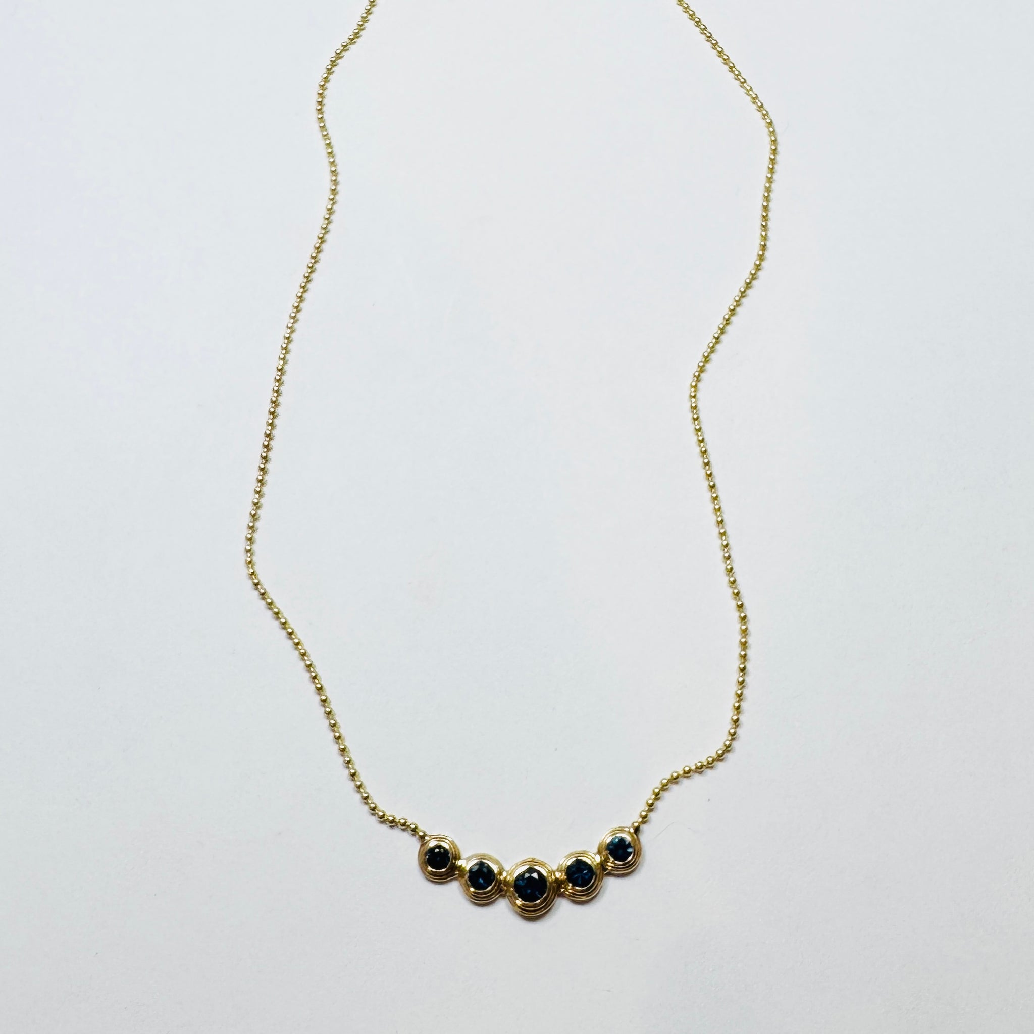 blue sapphire bezel set necklace