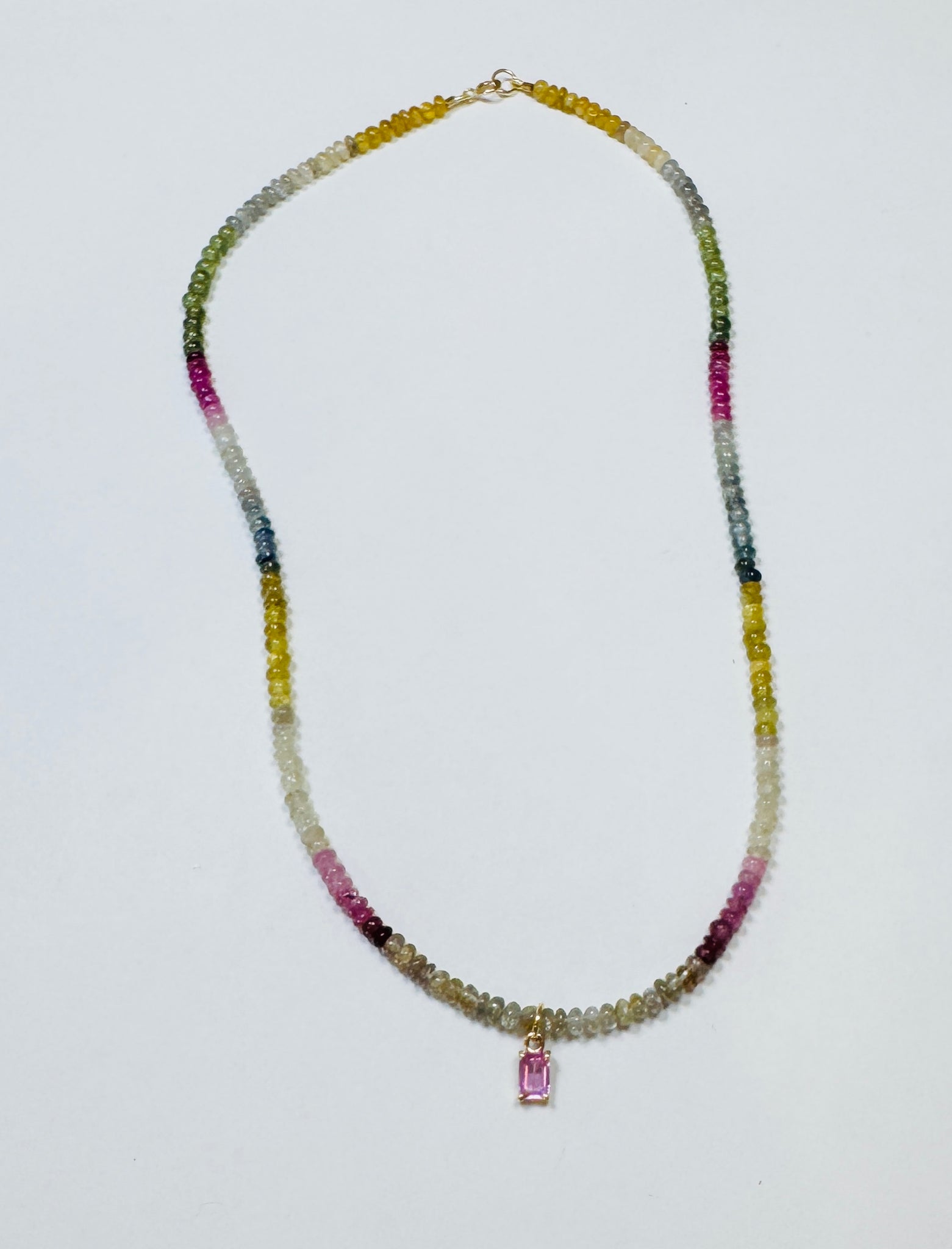 pink sapphire baguette on shaded sapphire heishi necklace