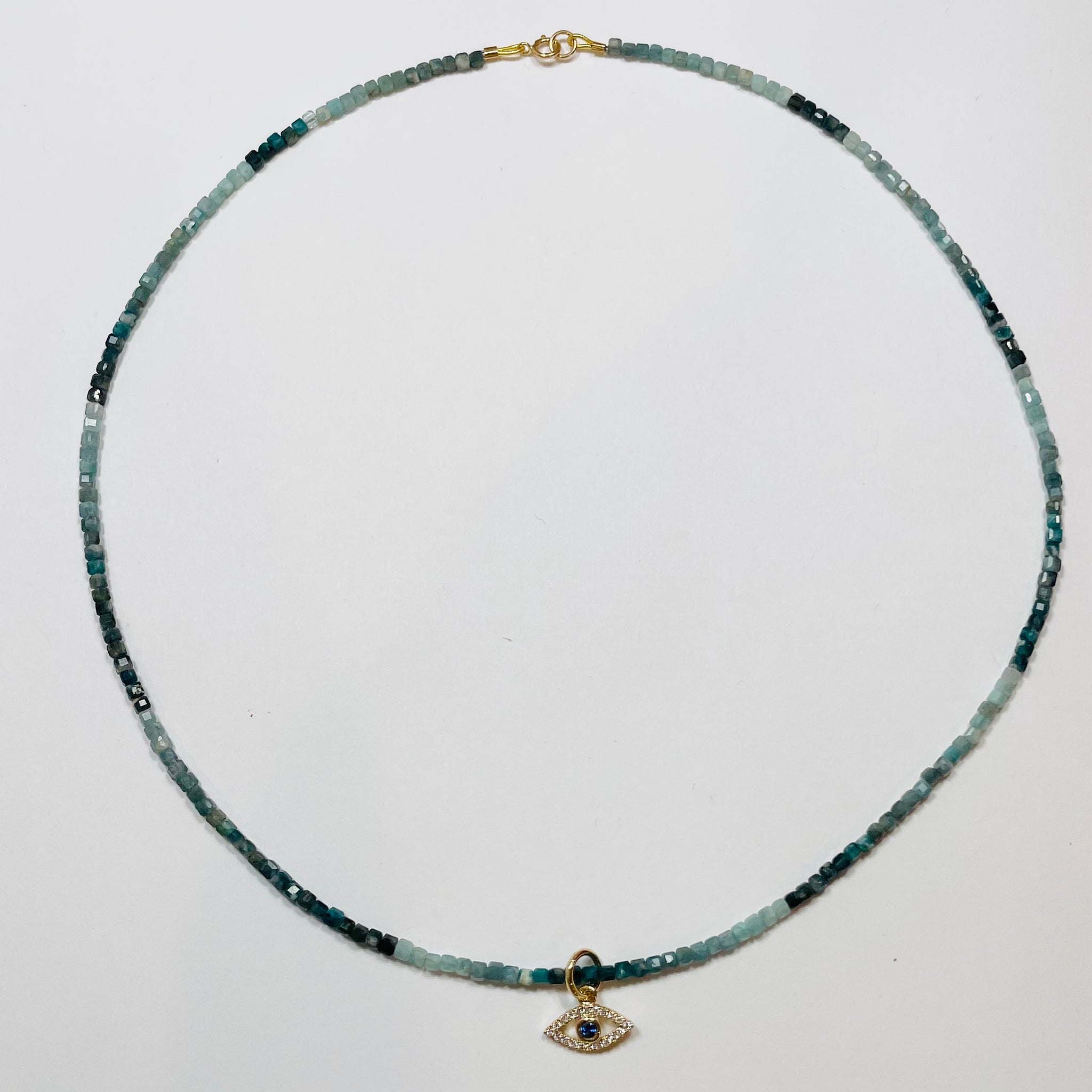 delicate block sapphire block necklace with evil eye charm