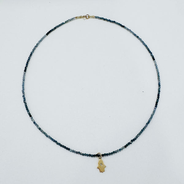 delicate gemstone necklace with hamsa charm