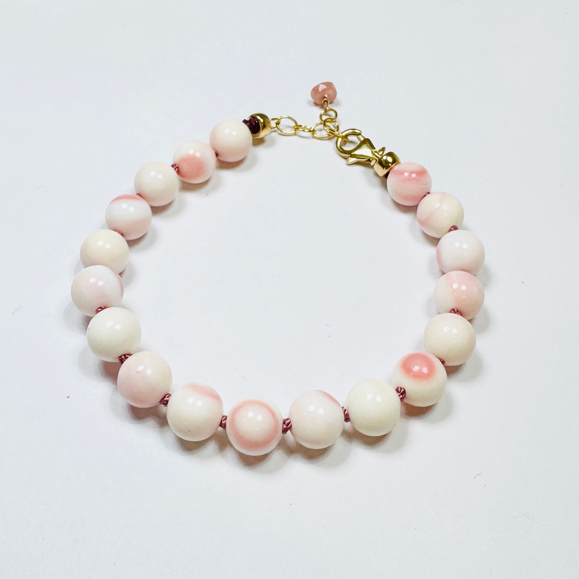 pink conch knotted bracelet