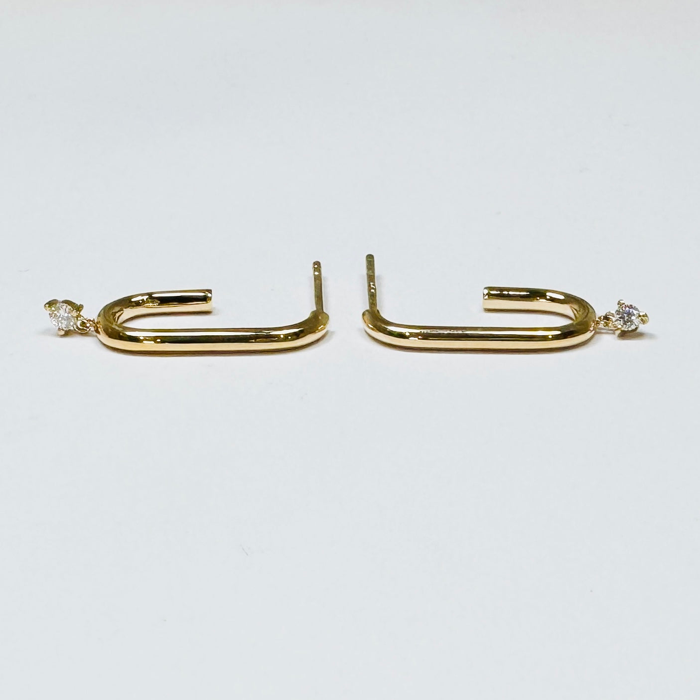 elongated gold hoops