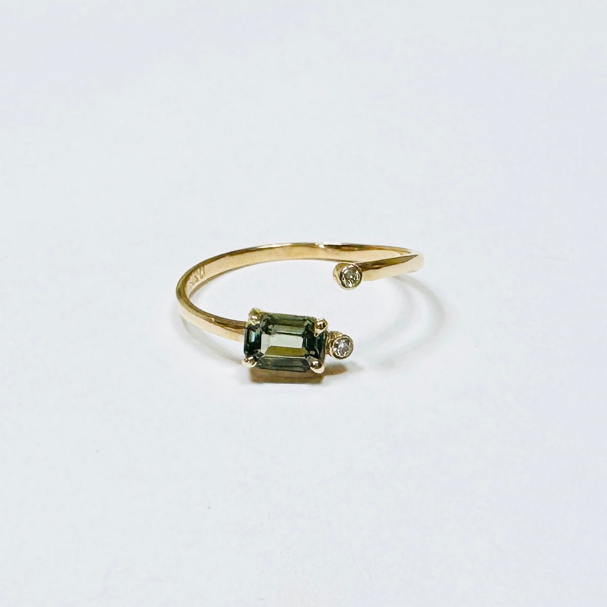 green sapphire baguette wrap ring