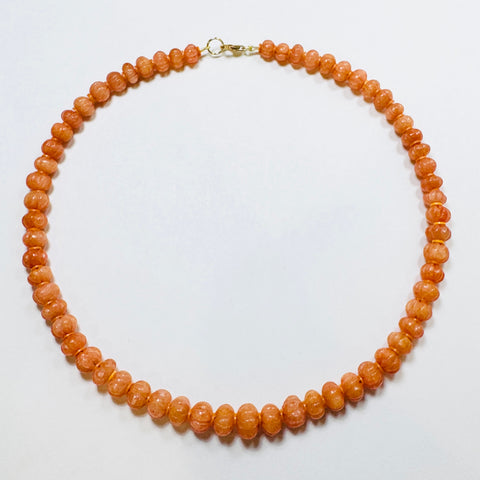 carved tangerine candy necklace