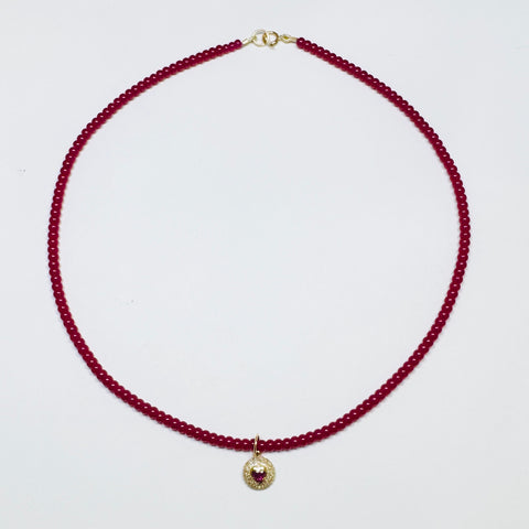 delicate smooth ruby necklace with dome heart charm