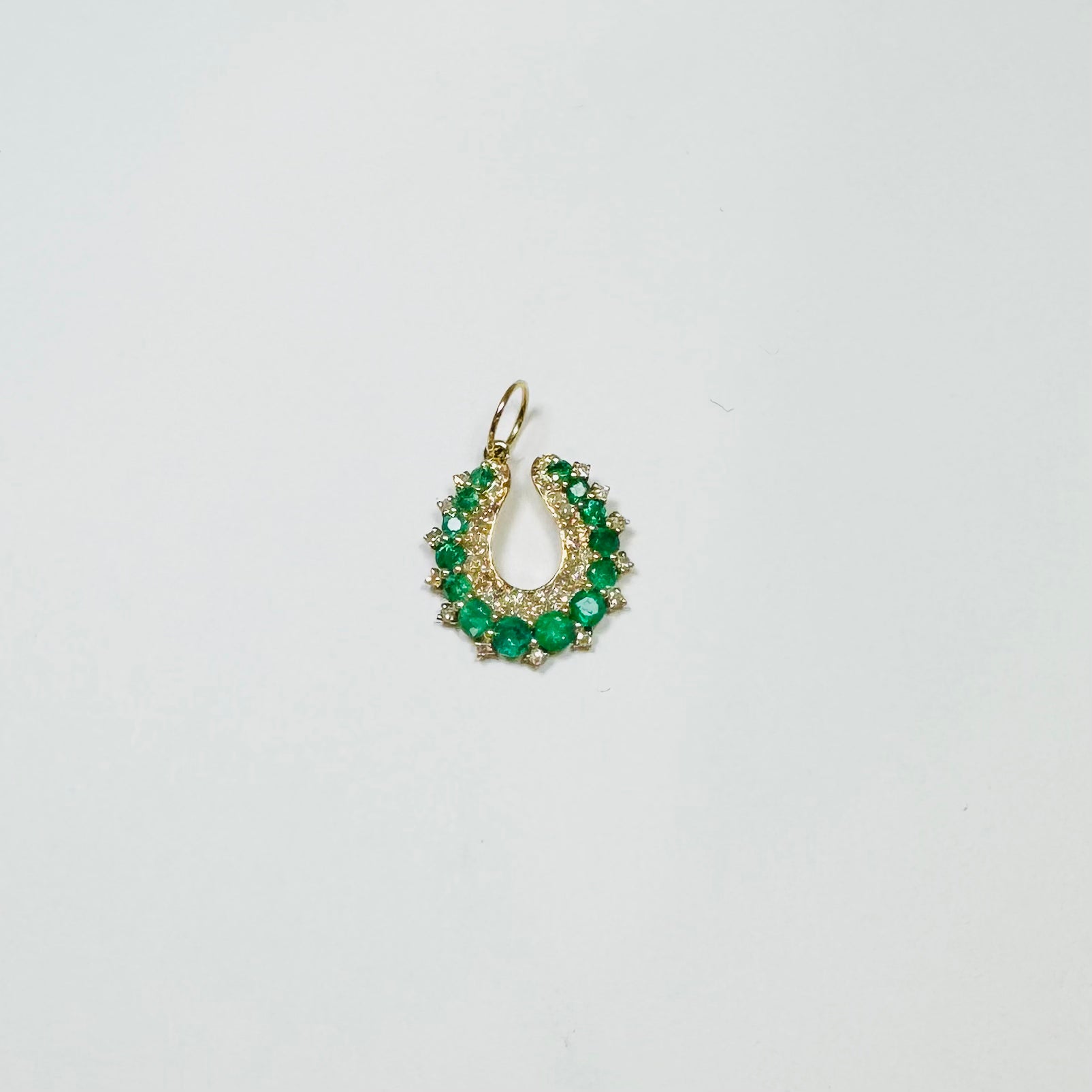 emerald horseshoe pendant