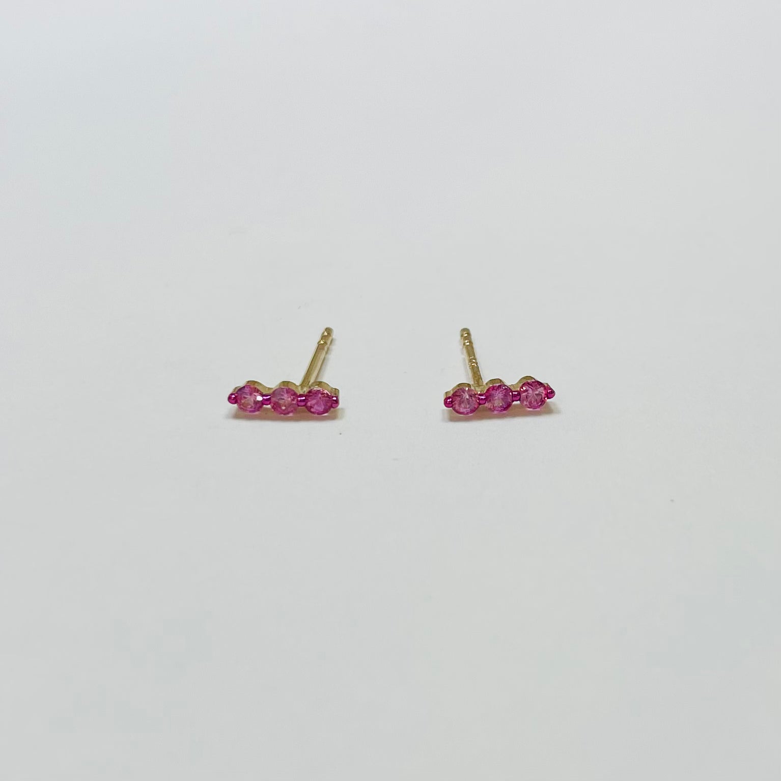 pink sapphire floating bar studs