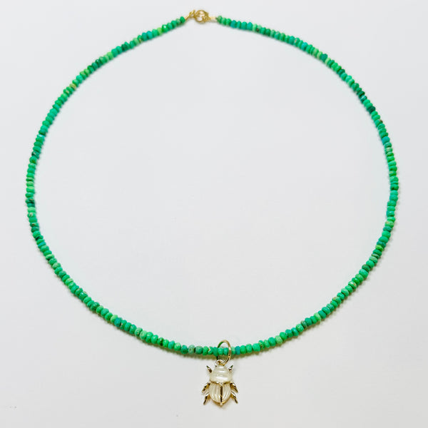 delicate neon green necklace with scarab pendant