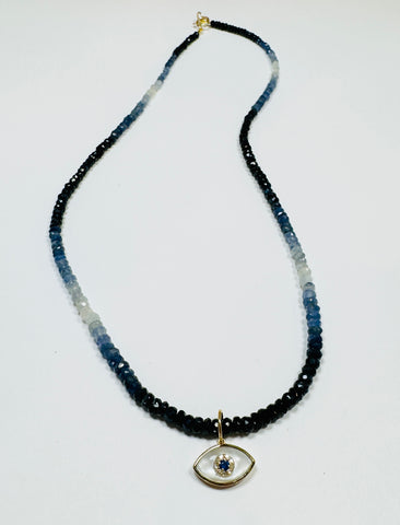 shaded blue sapphire necklace with evil eye charm