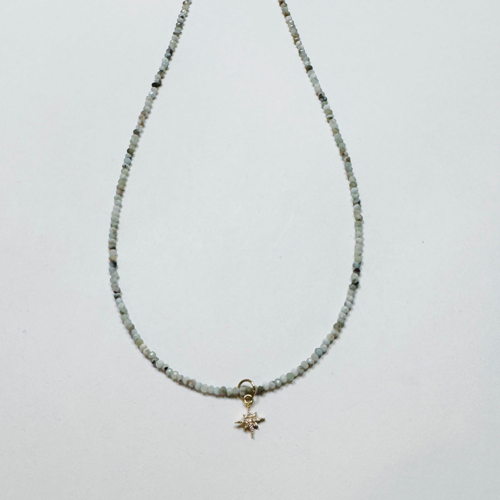 delicate Peruvian blue opal necklace with diamond starburst charm