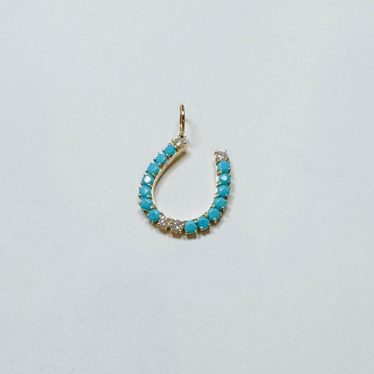 turquoise and diamond prong set horseshoe pendant, 1 inch
