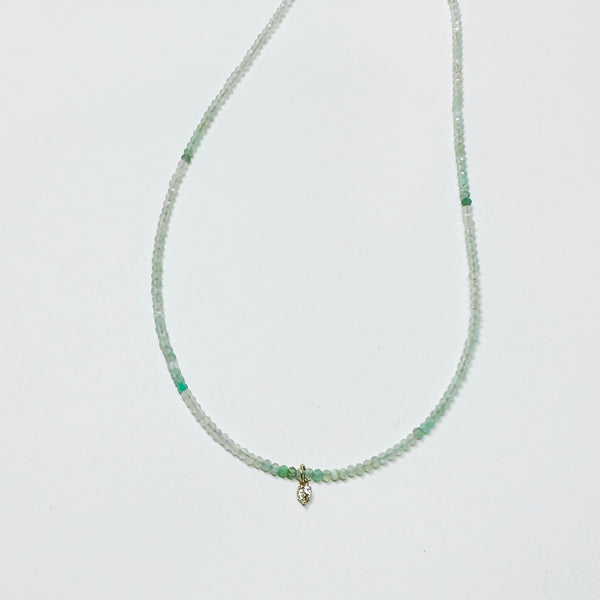 delicate necklace with prong set diamond