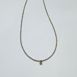 delicate necklace with bezel set diamond