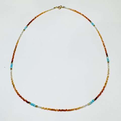 delicate shaded fire opal necklace with turquoise and gold nuggets