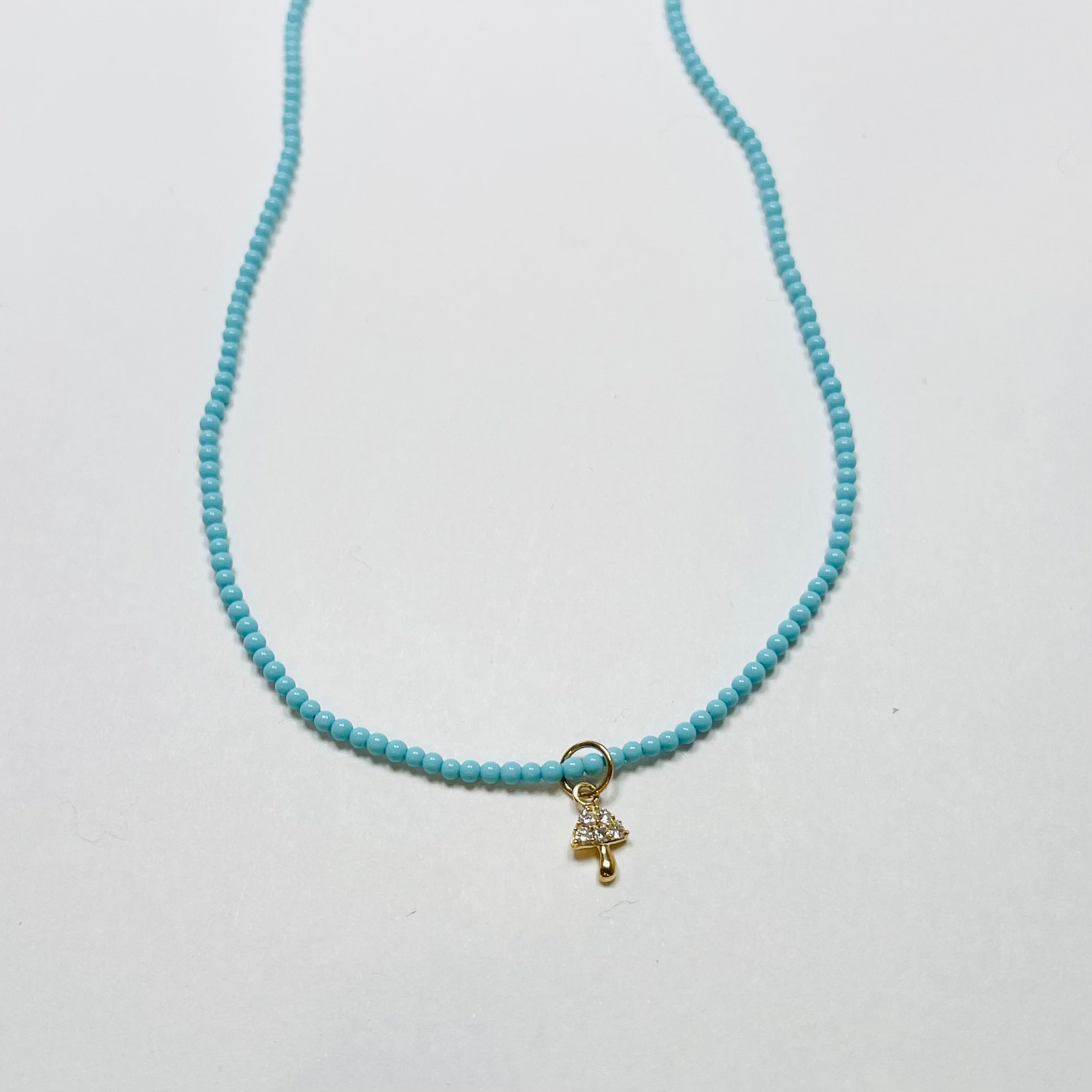 delicate turquoise necklace with mushroom charm