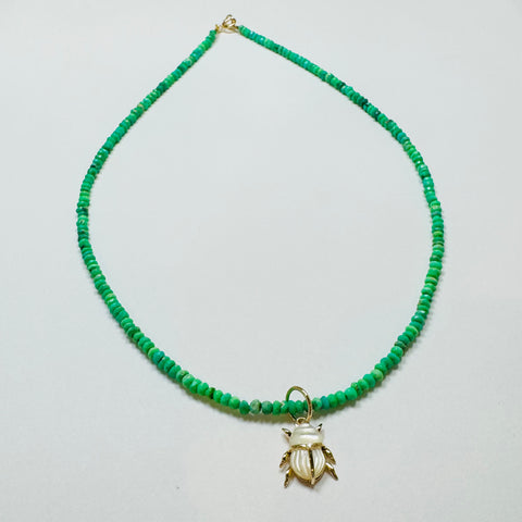 delicate neon green necklace with scarab pendant