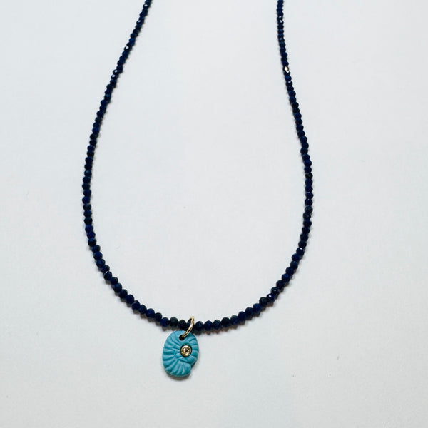 delicate lapis necklace with turquoise nautilus charm