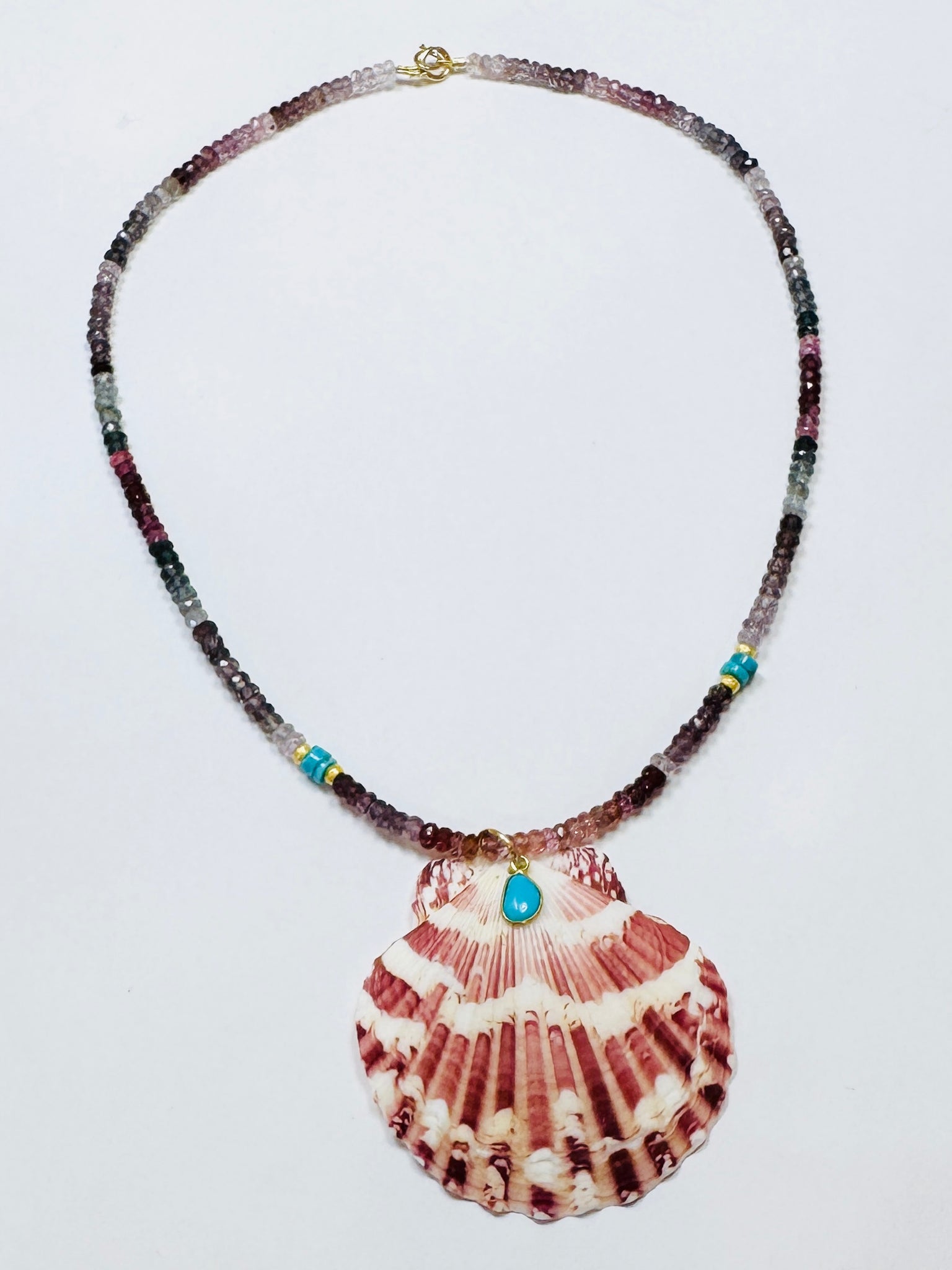 sapphire necklace with shell pendant